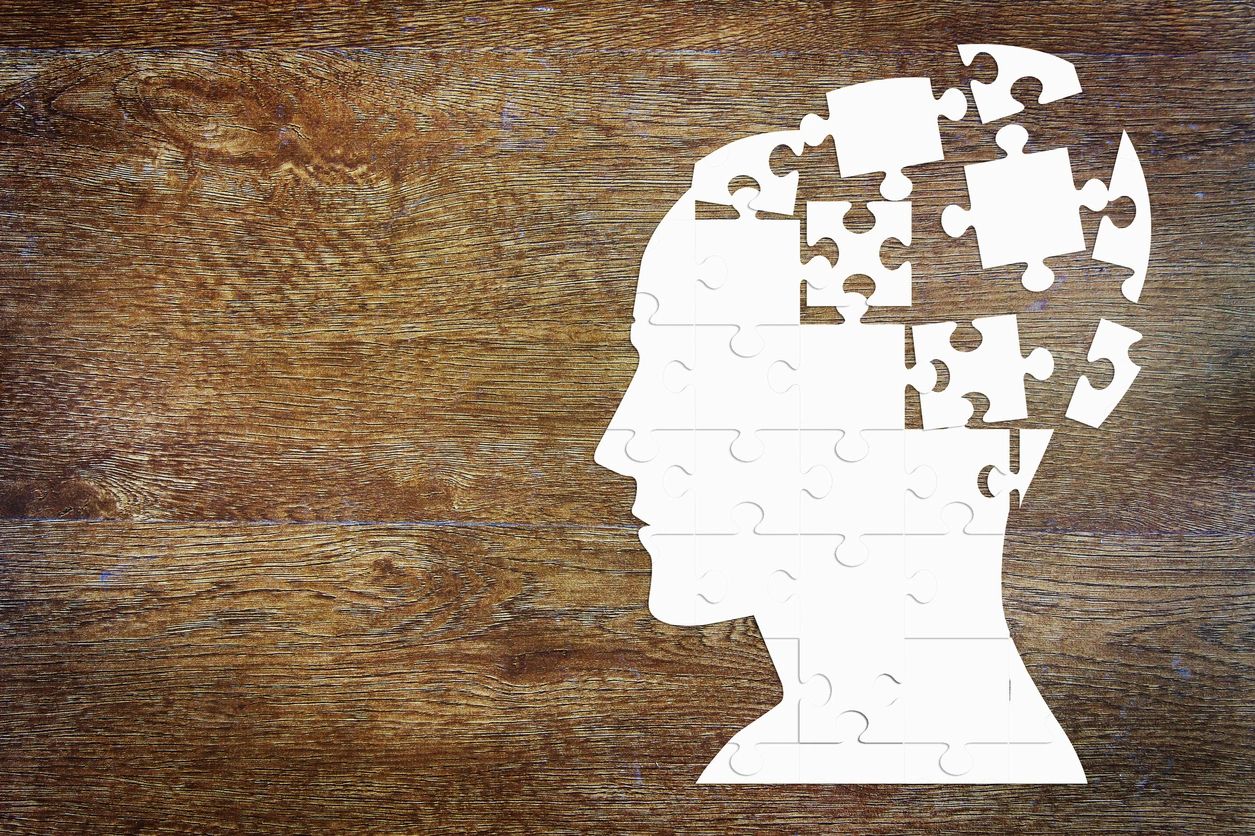 Head formed by puzzle pieces, symbolizing emotional design and its impact on user experience.